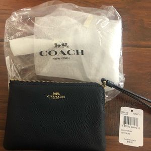 Coach wristlet wallet  color is a midnight navy